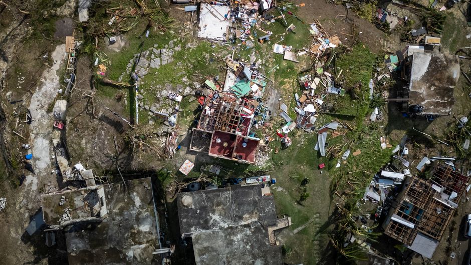 Aerial photograph showing severe structural damage after a hurricane.